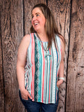 Model in front of a wood background wearing the Sunstripe Serape Tank Top.