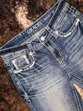 Angled view to show embroidered details on front pockets.