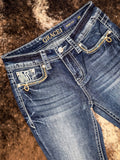 Angled view of front pockets to show embroidered details.