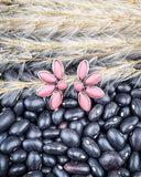 stud earrings on beans and wheat