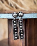 earrings on table