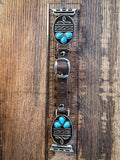 watch band on wood table