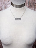 bar necklace on mannequin 