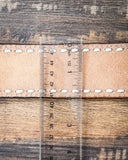 back of bracelet on wood with ruler