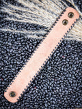 back of bracelet on beans and wheat