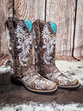 boots on cow hide, wood backdrop