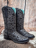 boots on cowhide, wood backdrop