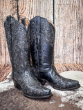 boots on cowhide, wood backdrop