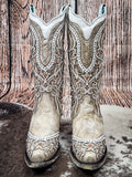 front boots on cowhide, wood backdrop