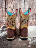 back of boots on cowhide, wood backdrop