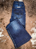 Trouser jeans folded on cowhide.