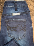Close up view of stitching details on the back pocket.