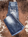 Trouser jeans folded on cowhide.