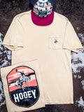 Front and back design on Cheyenne Hooey T-Shirt and hat displayed on cow hide.