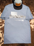 Front view of the Ol' Glory Hooey T-Shirt displayed on cowhide with a hat.