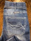 Close up of back pocket design on trouser jeans.