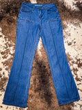 Front view of boot cut jeans displayed on cowhide.