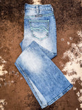 Boot cut Jeans displayed on cowhide.