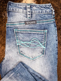 Close up of back pocket design on boot cut jeans.