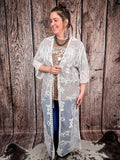 Model holding duster to Show off embroidered detail.