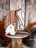 Side view of the Mountain Range Backpack on a wood background.