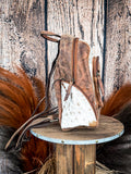 Side view of the Mountain Range Backpack on a wood background.