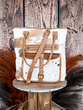 Front view of the Mesa Maverick Tote displayed on wood background.