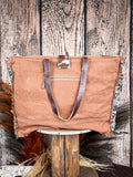Back view of the Fyole Weekender bag on a wood backdrop. 