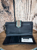 Inside view of the Western Swing Wristlet on a wood backdrop.