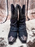 Front view of the Stardust Glitter Bootie in Black By Very G on a wood backdrop.