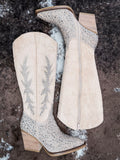 Flat lay view of the Addie Glitter Knee High Boot in Taupe By Very G on cowhide.