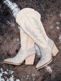Flat lay view of the Addie Glitter Knee High Boot in Taupe By Very G on cowhide.