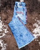 Folded flat lay of the Cowgirl Tuff Blazn' Red Trouser Jeans.