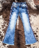 Flat lay of the Cowgirl Tuff Blazn' Red Trouser Jeans.