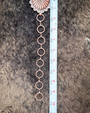 Tape measure showing the size of the extender on the Sunfire Concho Chain Belt.