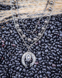 Three Trails Squash Blossom Fashion Necklace displayed on beans and wheat.