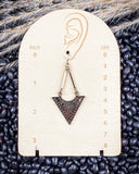 Mesa Sunrise Fashion Dangle Earrings displayed on a ruler, sitting on beans and wheat.