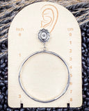 High Desert Concho Fashion Hoops displayed on a ruler, sitting on beans and wheat. 