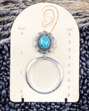Blue Mesa Fashion Hoops displayed on a ruler, sitting on beans and wheat.