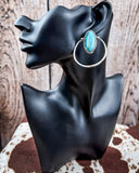 Sage Hollow Fashion Hoop Earrings on a mannequin, sitting on cowhide, wood back drop.