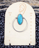 Sage Hollow Fashion Hoop Earrings on a ruler, displayed on beans and wheat.