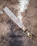 Classic Country Hand-Tooled Key Fob displayed on cowhide.