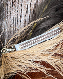 Diamond Shine Hand-Tooled Strap Key Fob displayed on wheat, wood back drop.