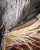 Canyon Spire Key Fob in Multicolor displayed on wheat, wood back drop.