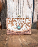 Front view of the Mesa Terra Vintage Style Wallet displayed on a wood table, wood backdrop.