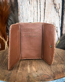 Inside of the Mesa Terra Vintage Style Wallet, displayed on a wood table with a wood backdrop.