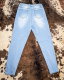 Back view of the High Noon Skinny Jeans displayed on cowhide.