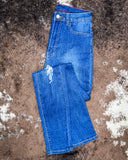 The Badlands Rip Skinny Jeans displayed on cowhide.