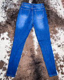 Back view of the Badlands Rip Skinny Jeans displayed on cowhide.