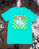 Front view of the Buckin Babe Howdy Graphic Tee displayed on cowhide. 